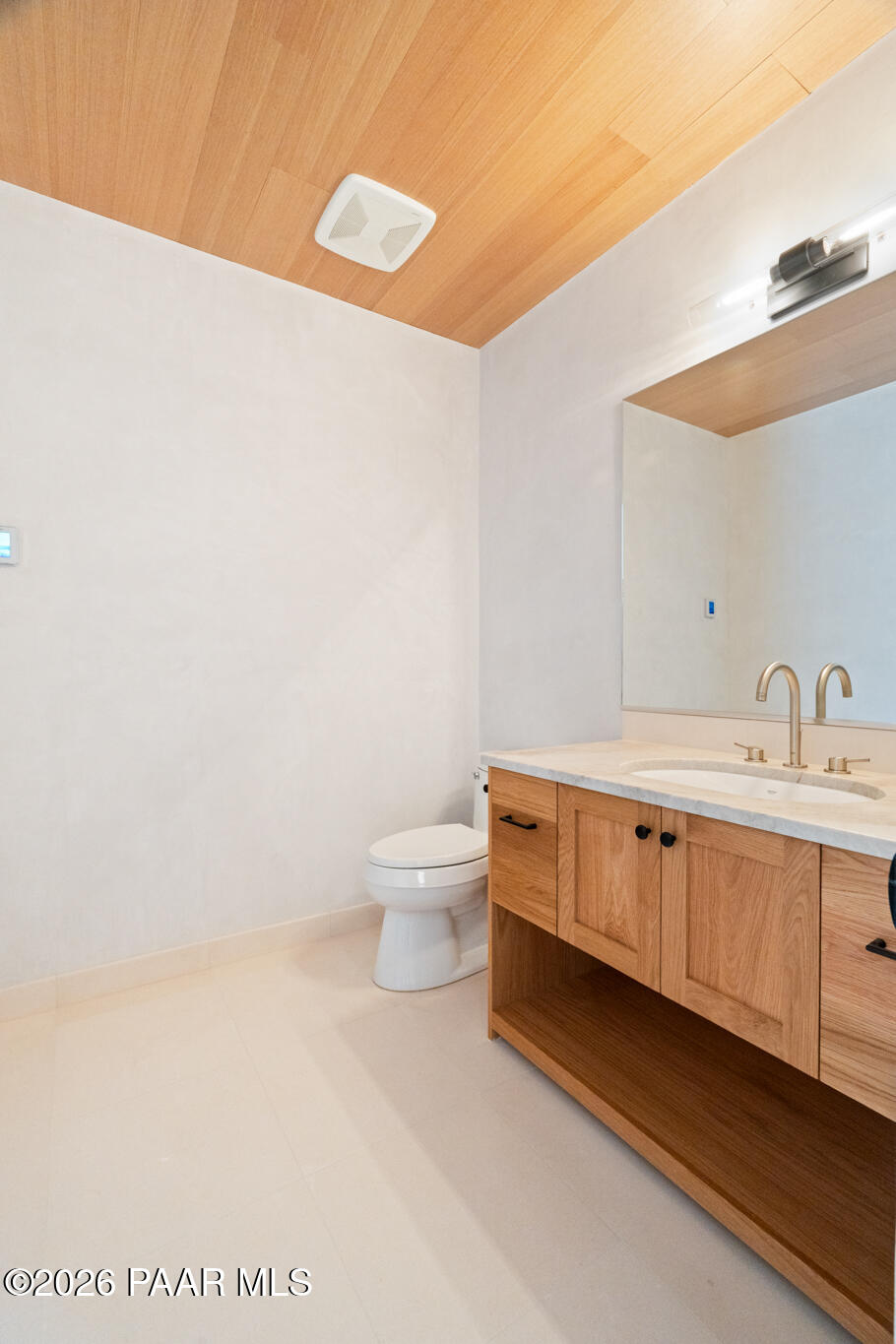 1090 High Valley Ranch Road Prescott, AZ 86303 - Photo 48 of 65 a spacious bathroom with a double vanity sink and a toilet