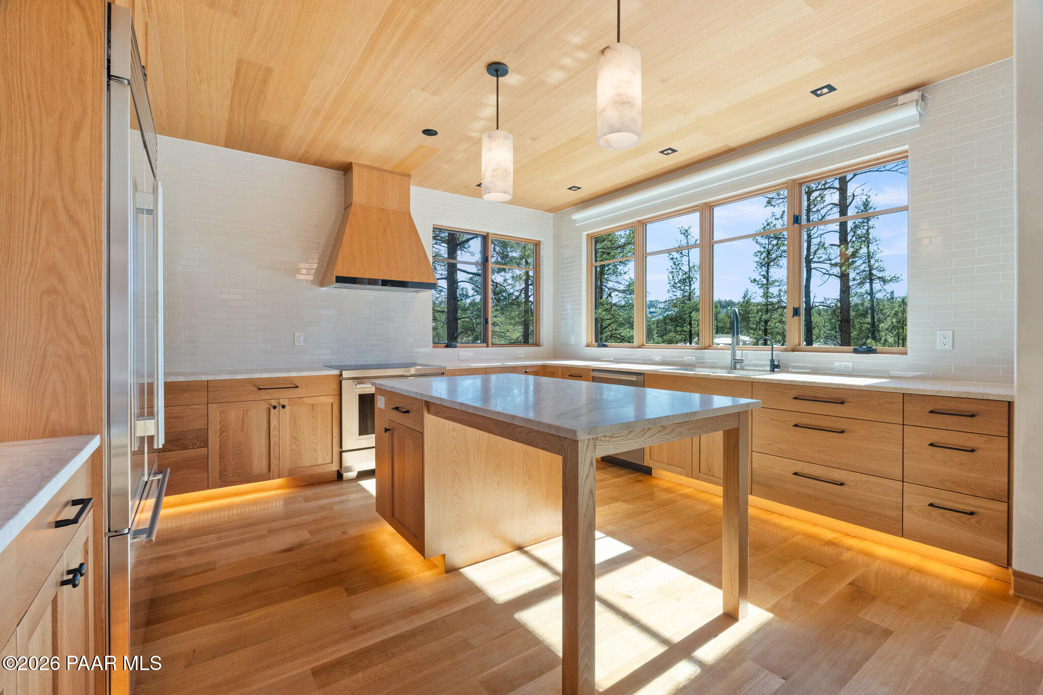 1090 High Valley Ranch Road Prescott, AZ 86303 - Photo 8 of 65 a kitchen with stainless steel appliances kitchen island granite countertop a stove and a large window