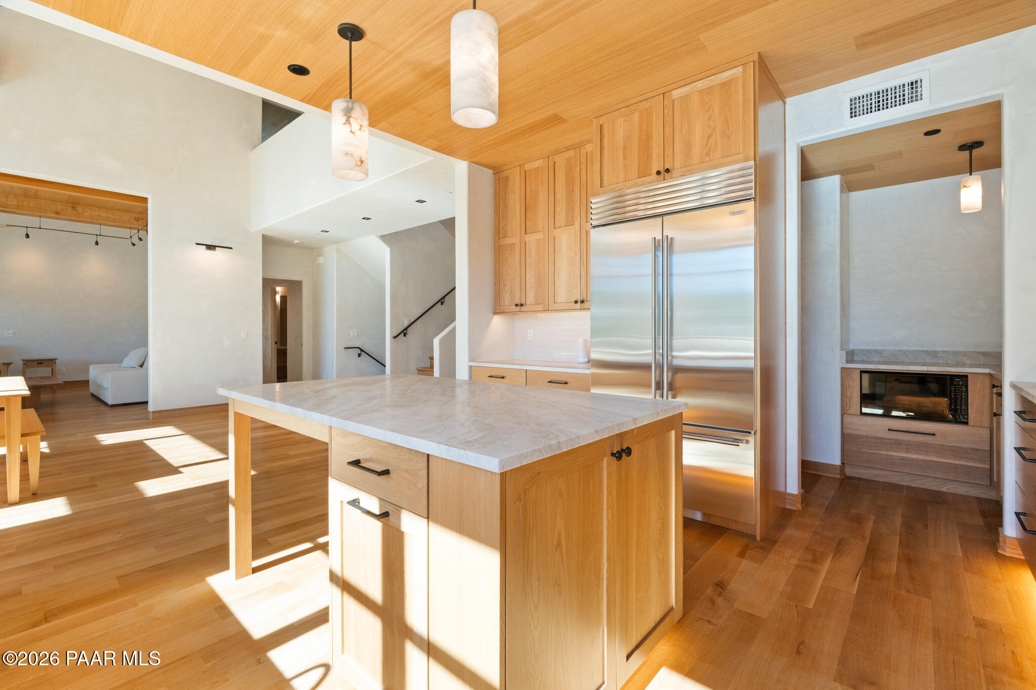 1090 High Valley Ranch Road Prescott, AZ 86303 - Photo 10 of 65 a kitchen with a sink a refrigerator and a stove