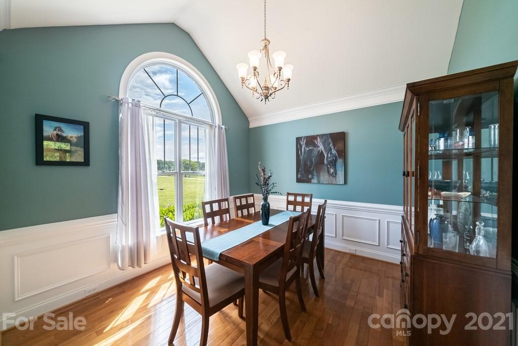 310 Bridle Path Farm Road Cleveland, NC 27013 - Photo 13 of 48 a view of a dining room with furniture window and wooden floor