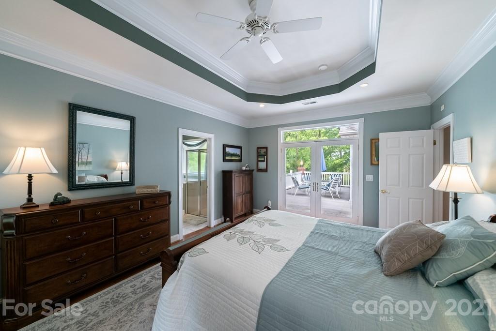 310 Bridle Path Farm Road Cleveland, NC 27013 - Photo 15 of 48 a bedroom with a large bed and a large dresser