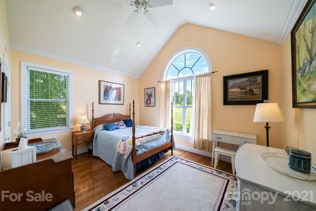 310 Bridle Path Farm Road Cleveland, NC 27013 - Photo 18 of 48 a bedroom with furniture and a window