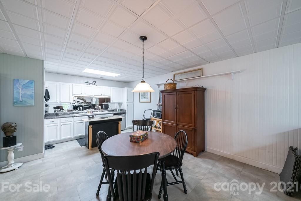 310 Bridle Path Farm Road Cleveland, NC 27013 - Photo 22 of 48 a kitchen with a table and chairs in it