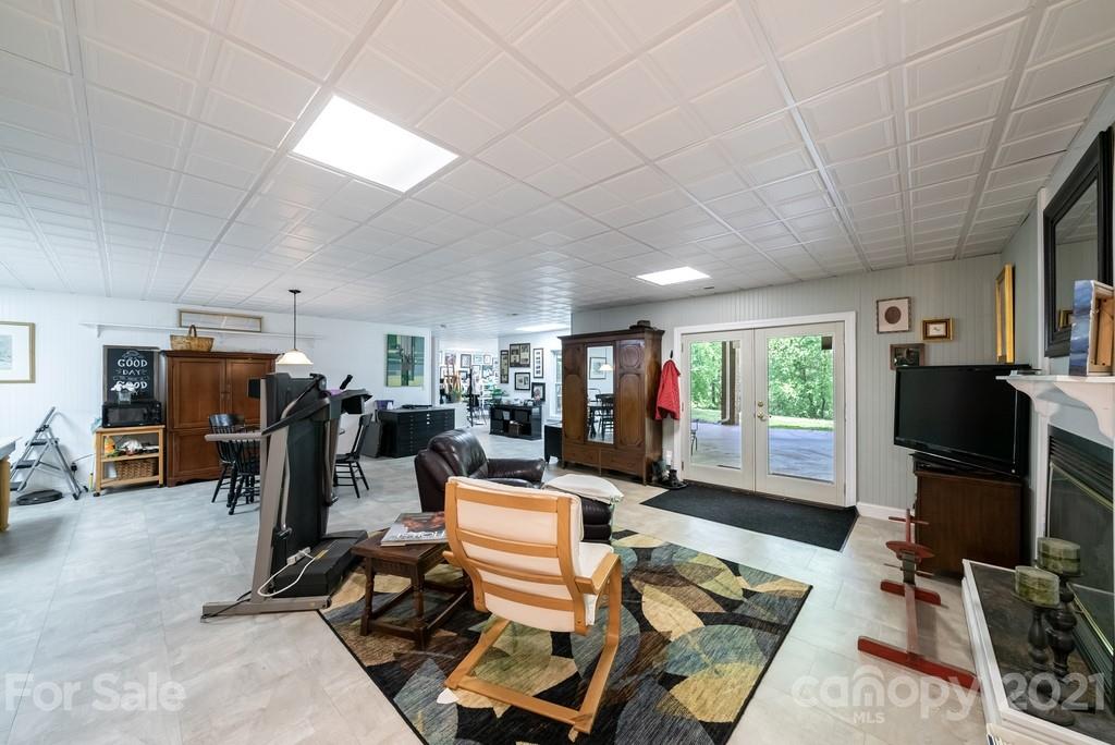 310 Bridle Path Farm Road Cleveland, NC 27013 - Photo 23 of 48 a living room with furniture a flat screen tv and a large window