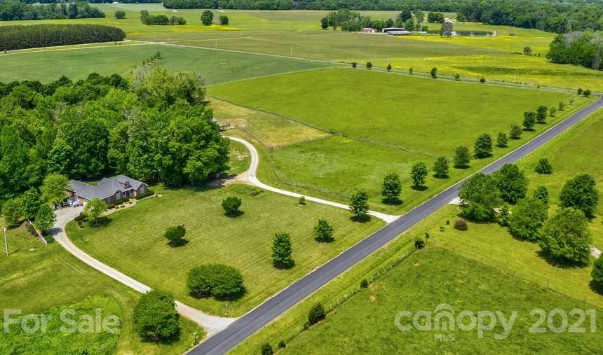 310 Bridle Path Farm Road Cleveland, NC 27013 - Photo 44 of 48 a view of a swimming pool and a yard