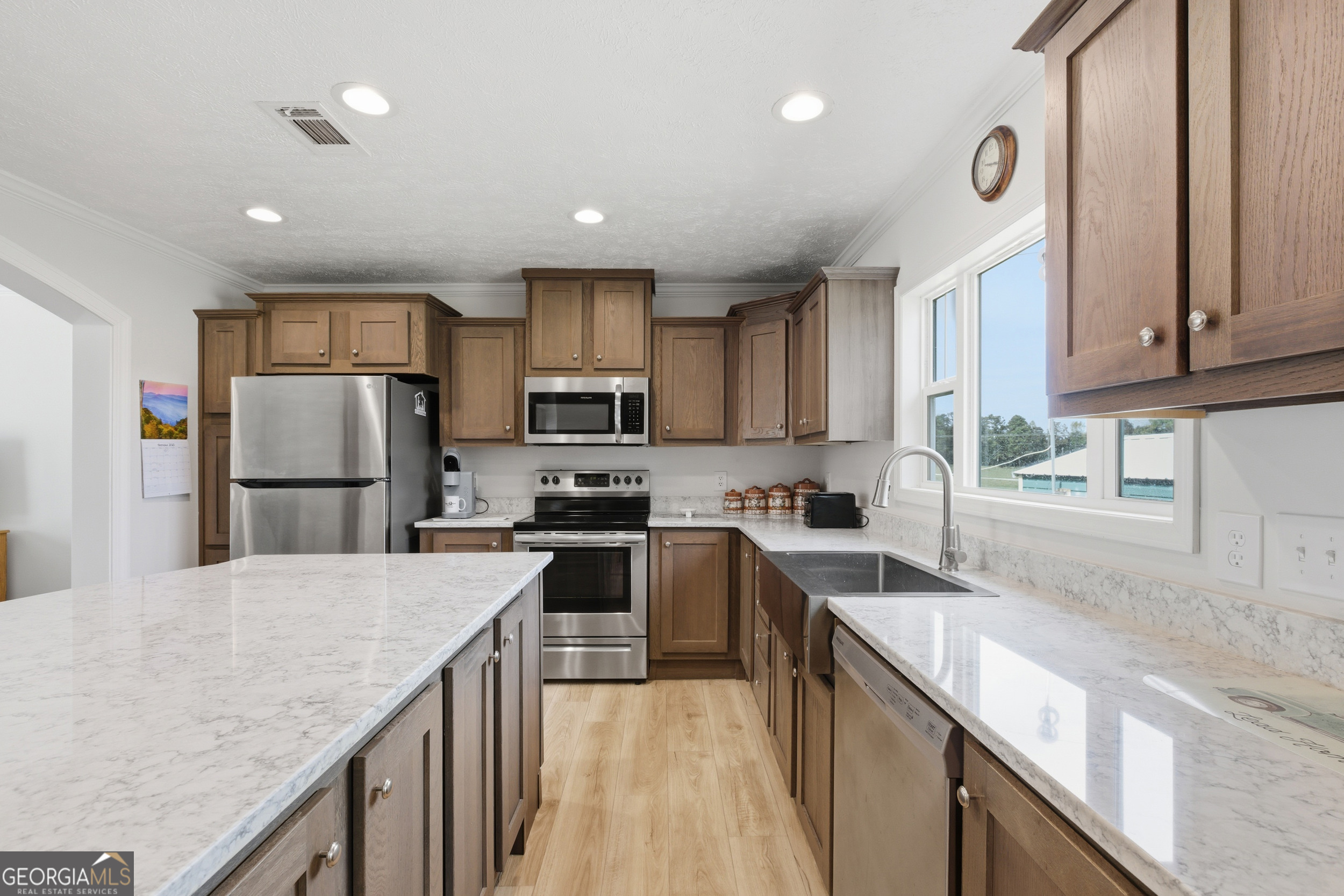 219 Eastanollee Road Eastanollee, GA 30538 - Photo 11 of 49 a kitchen with stainless steel appliances granite countertop a refrigerator sink stove microwave and cabinets