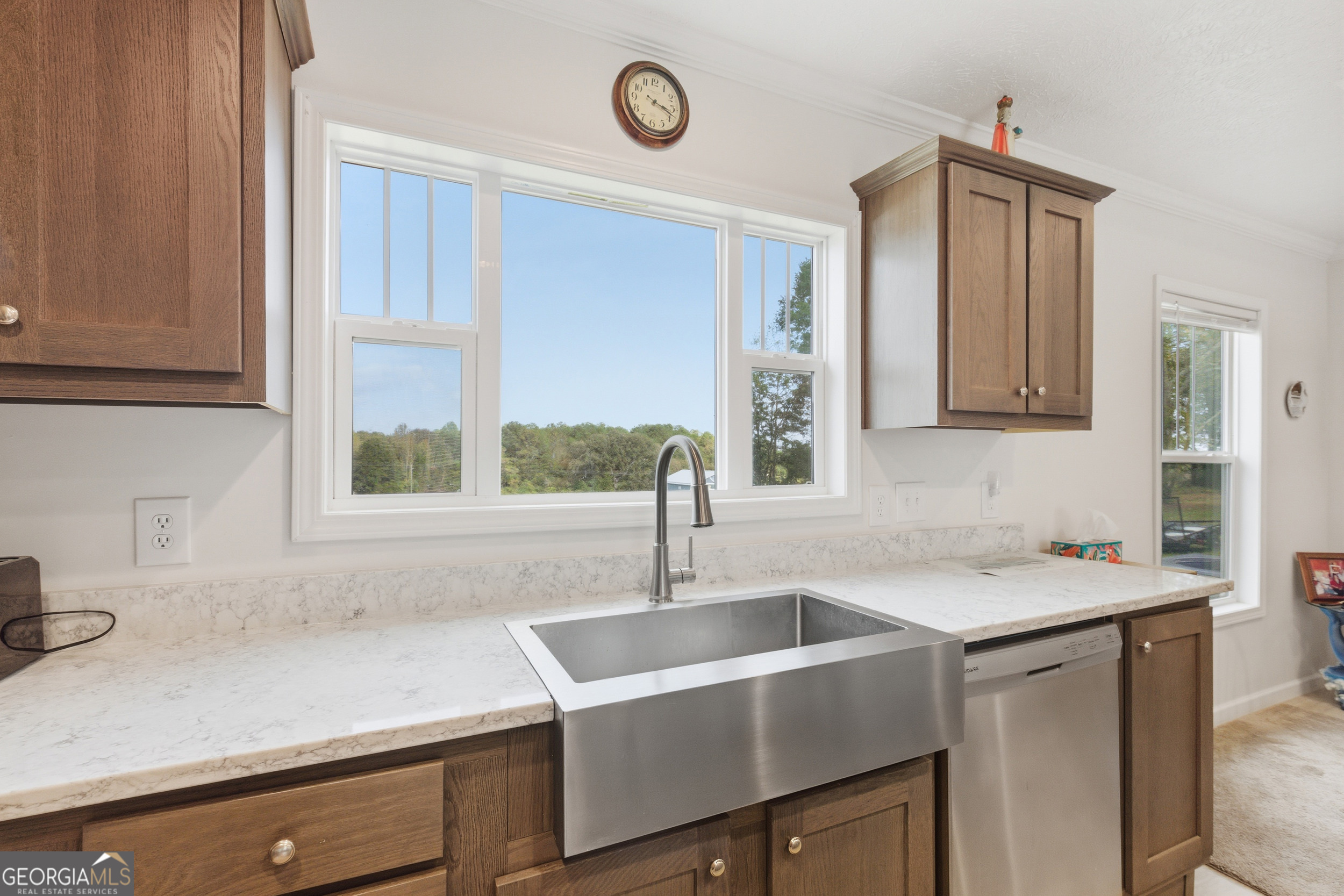 219 Eastanollee Road Eastanollee, GA 30538 - Photo 13 of 49 a view with granite countertop a sink a window and cabinets
