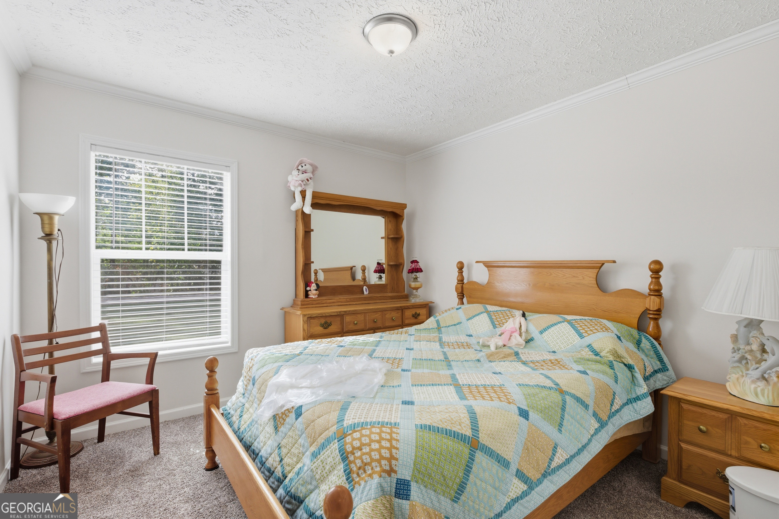 219 Eastanollee Road Eastanollee, GA 30538 - Photo 23 of 49 a bedroom with a bed and chair