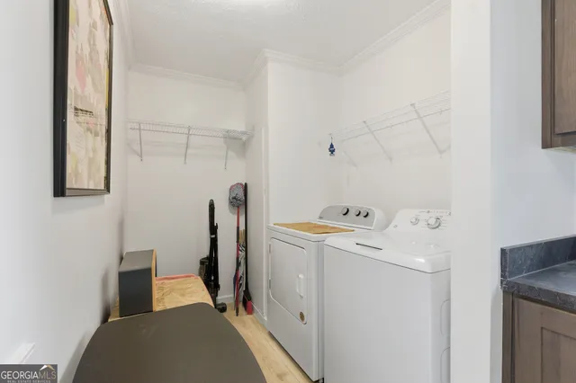 a view of storage and utility room with utility room