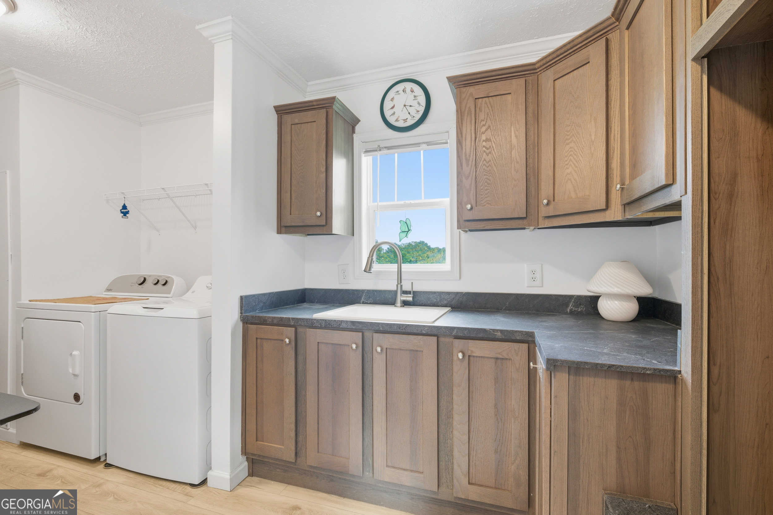 219 Eastanollee Road Eastanollee, GA 30538 - Photo 27 of 49 a kitchen with a sink and cabinets