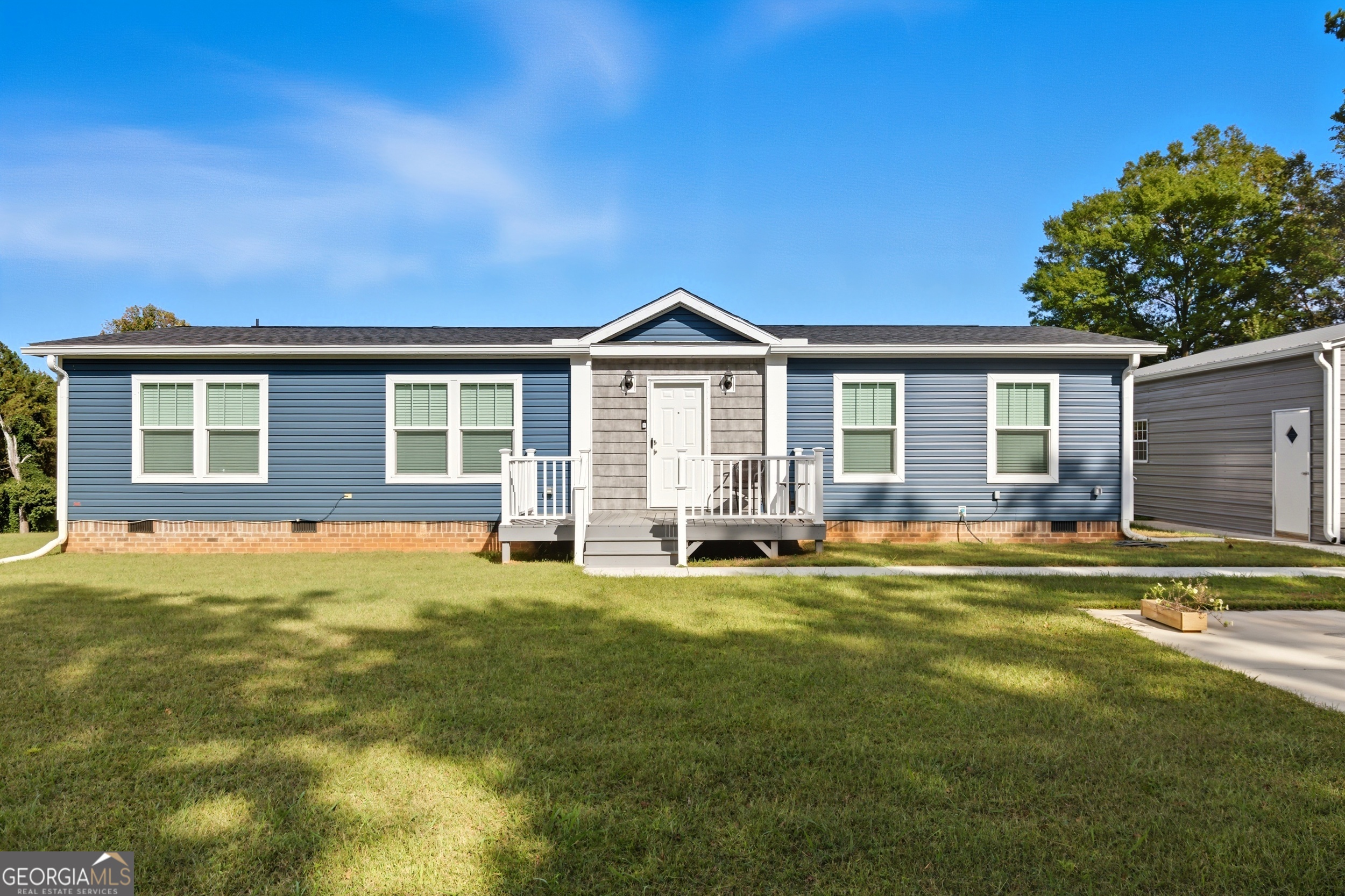 219 Eastanollee Road Eastanollee, GA 30538 - Photo 3 of 49 a view of a house with a patio and a yard