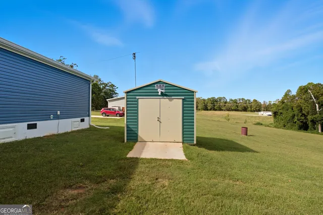 a view of a garage with cars and other equipment