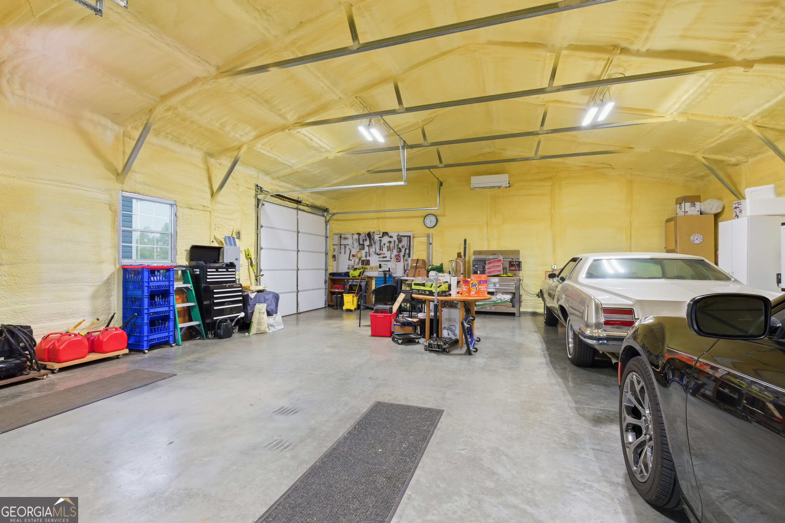 219 Eastanollee Road Eastanollee, GA 30538 - Photo 34 of 49 a view of a garage with cars and other equipment