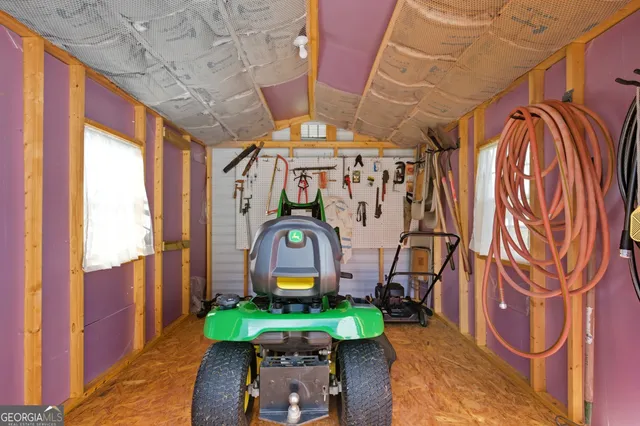 a view of a garage with parked cars