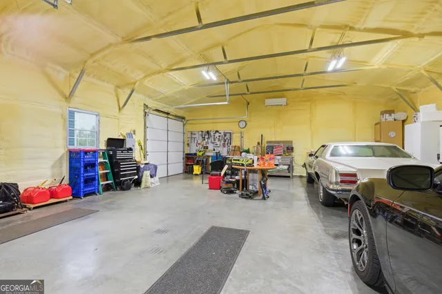 a view of a large pool with an outdoor seating and a yard