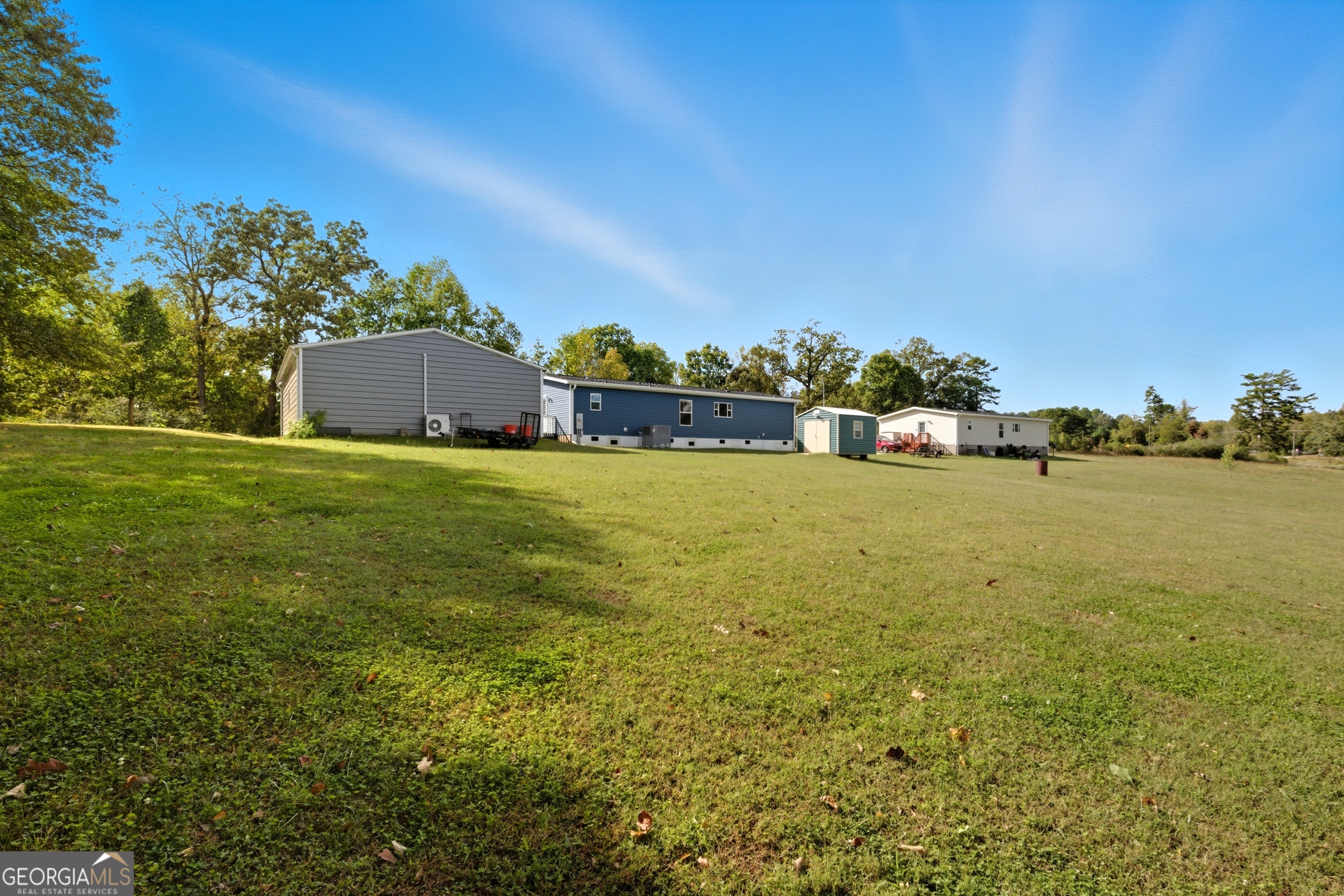 219 Eastanollee Road Eastanollee, GA 30538 - Photo 37 of 49 a view of a large pool with an outdoor seating and a yard
