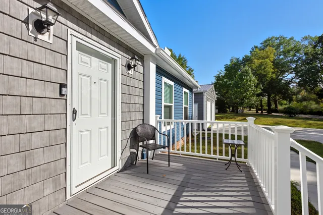 a view of a chair and tables in the balcony