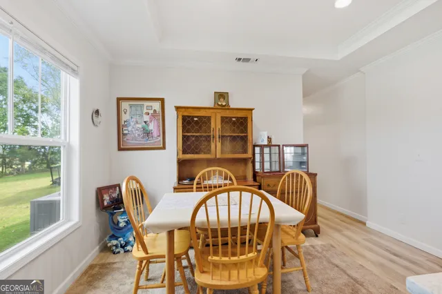 a view of a chairs and table in a room