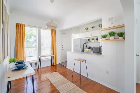 a living room with furniture and a table