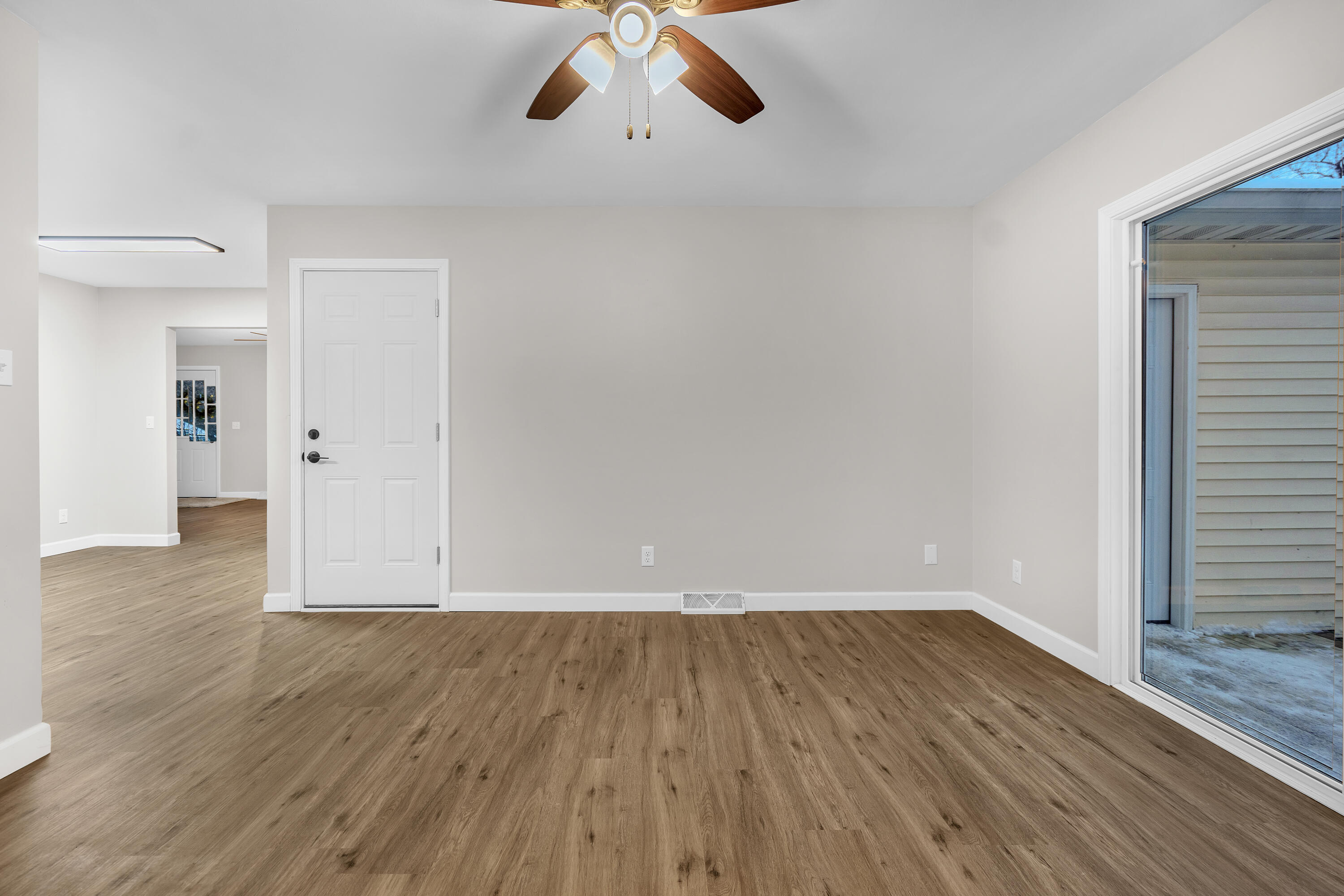 3902 North Explorer Lane Wheatfield, IN 46392 - Photo 11 of 34 wooden floor in an empty room with a window