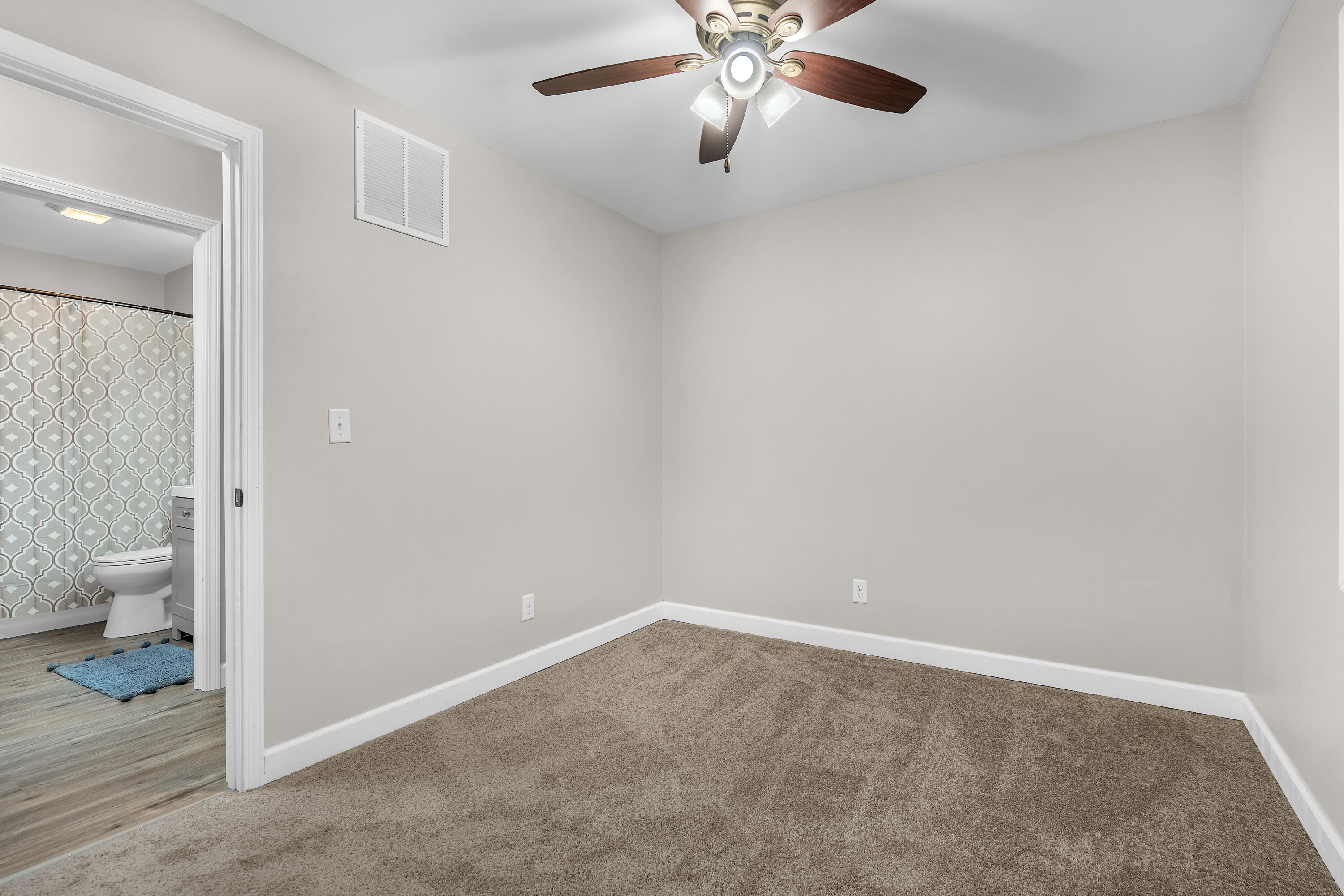3902 North Explorer Lane Wheatfield, IN 46392 - Photo 17 of 34 an empty room and a bathroom with a toilet