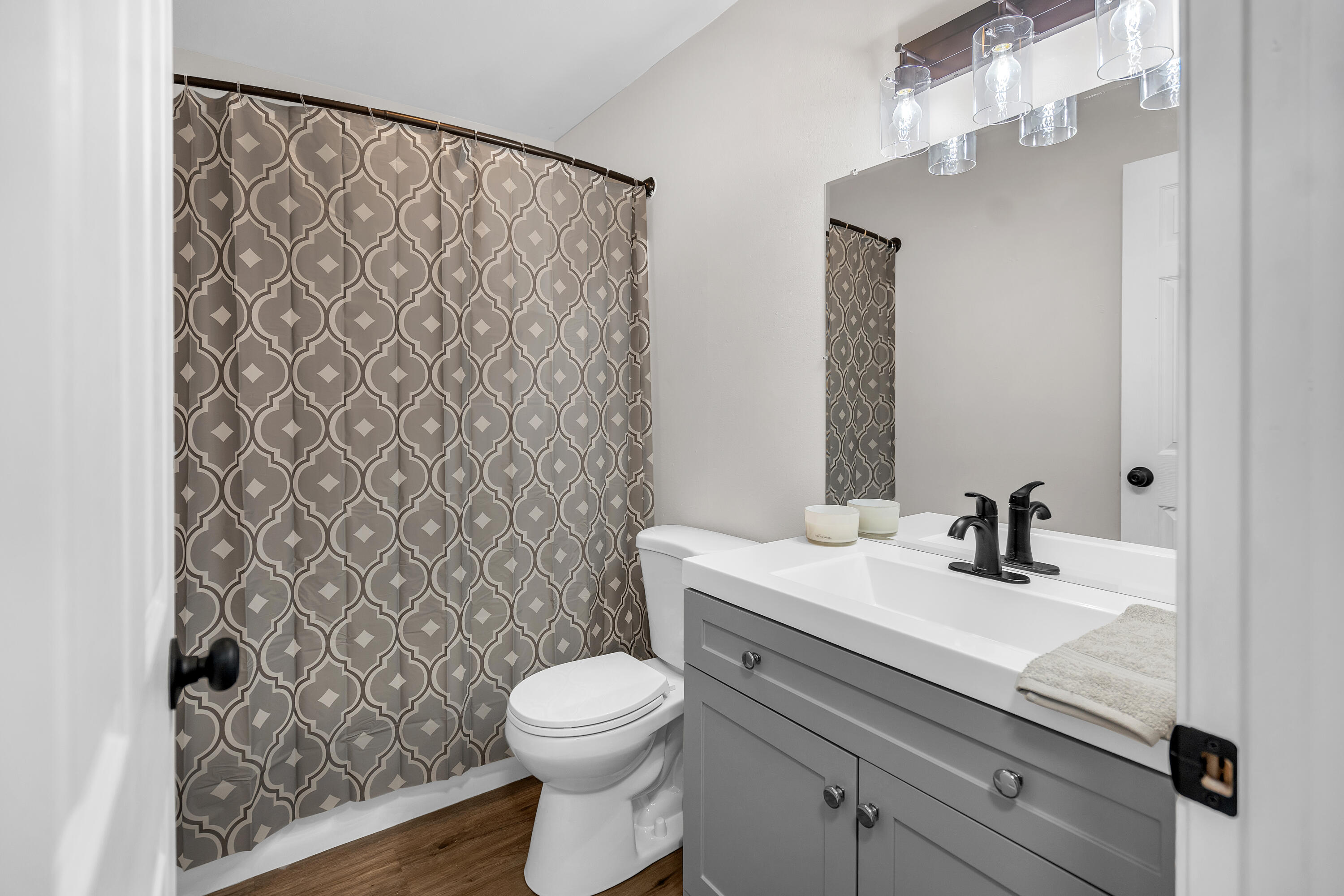 3902 North Explorer Lane Wheatfield, IN 46392 - Photo 21 of 34 a bathroom with a sink a toilet and a mirror