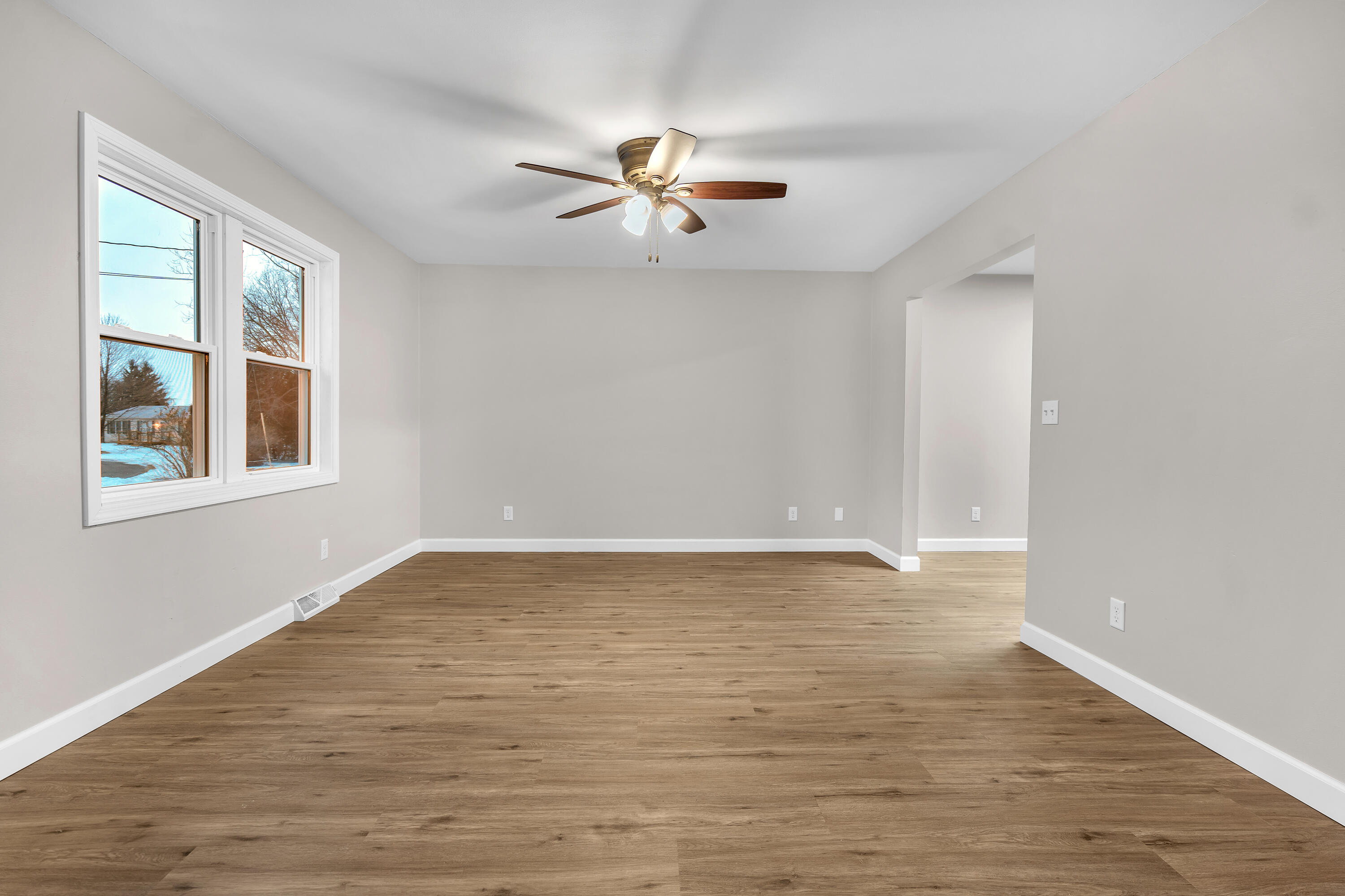 3902 North Explorer Lane Wheatfield, IN 46392 - Photo 3 of 34 a view of empty room with wooden floor and fan