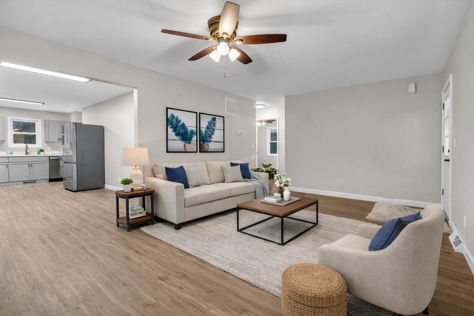 3902 North Explorer Lane Wheatfield, IN 46392 - Photo 6 of 34 a living room with furniture and a chandelier