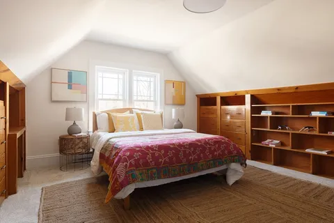 a bathroom with a sink toilet and mirror