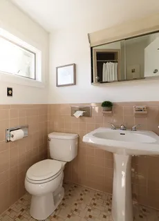 a backyard of a house with fountain and outdoor seating