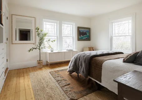 a bedroom with a bed and a couch