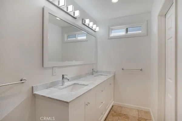 a bedroom with a bed and a chair