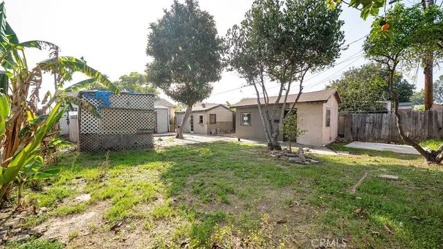 a house view with a backyard space