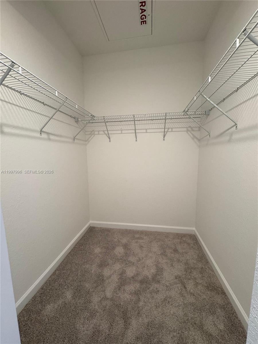 15615 Southwest 280th Street, Unit 10 Homestead, FL 33032 - Photo 15 of 23 a view of a room with racks on the wall