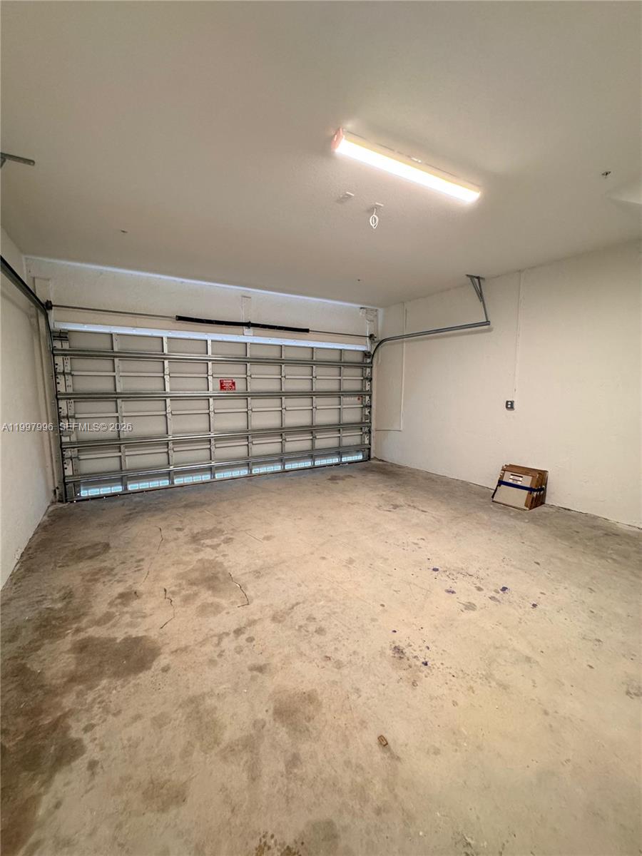 15615 Southwest 280th Street, Unit 10 Homestead, FL 33032 - Photo 3 of 23 a view of a garage