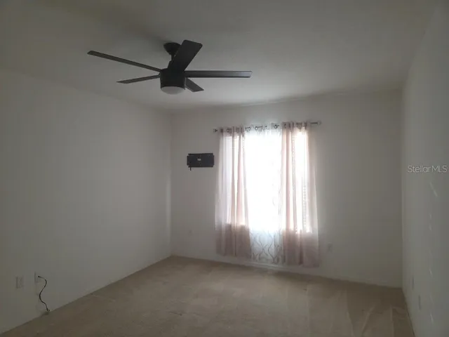 an empty room that has a window