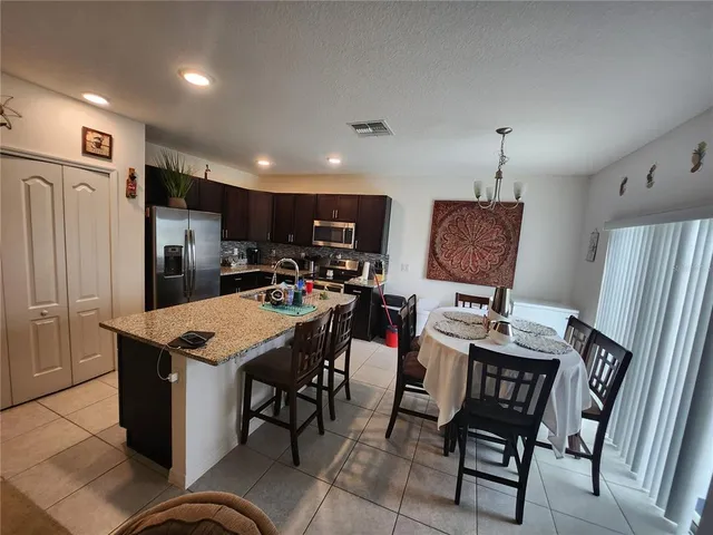 a view of a dining room with furniture