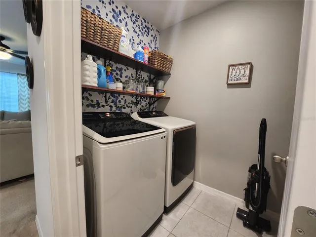 a utility room with dryer and washer