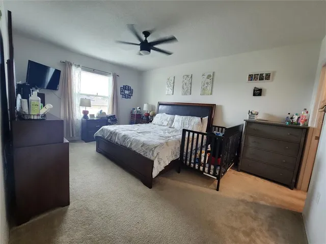 a bedroom with a bed and dresser