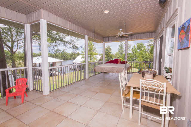 14259 Riverside Drive Foley, AL 36535 - Photo 11 of 25 This porch is where you will spend your days and nights!