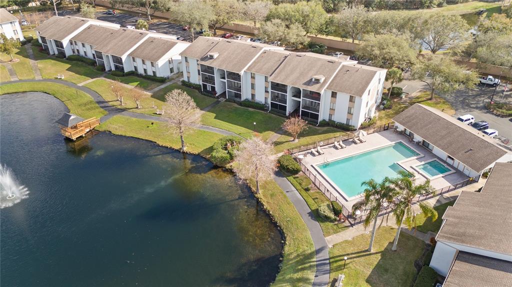8203 Sun Spring Circle, Unit 12 Orlando, FL 32825 - Photo 37 of 38 an aerial view of a house with swimming pool and outdoor space