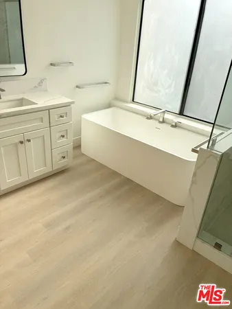 a view of a house with pool and a yard