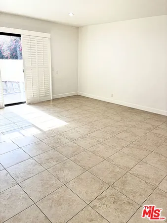 a large kitchen with stainless steel appliances granite countertop a sink and a stove