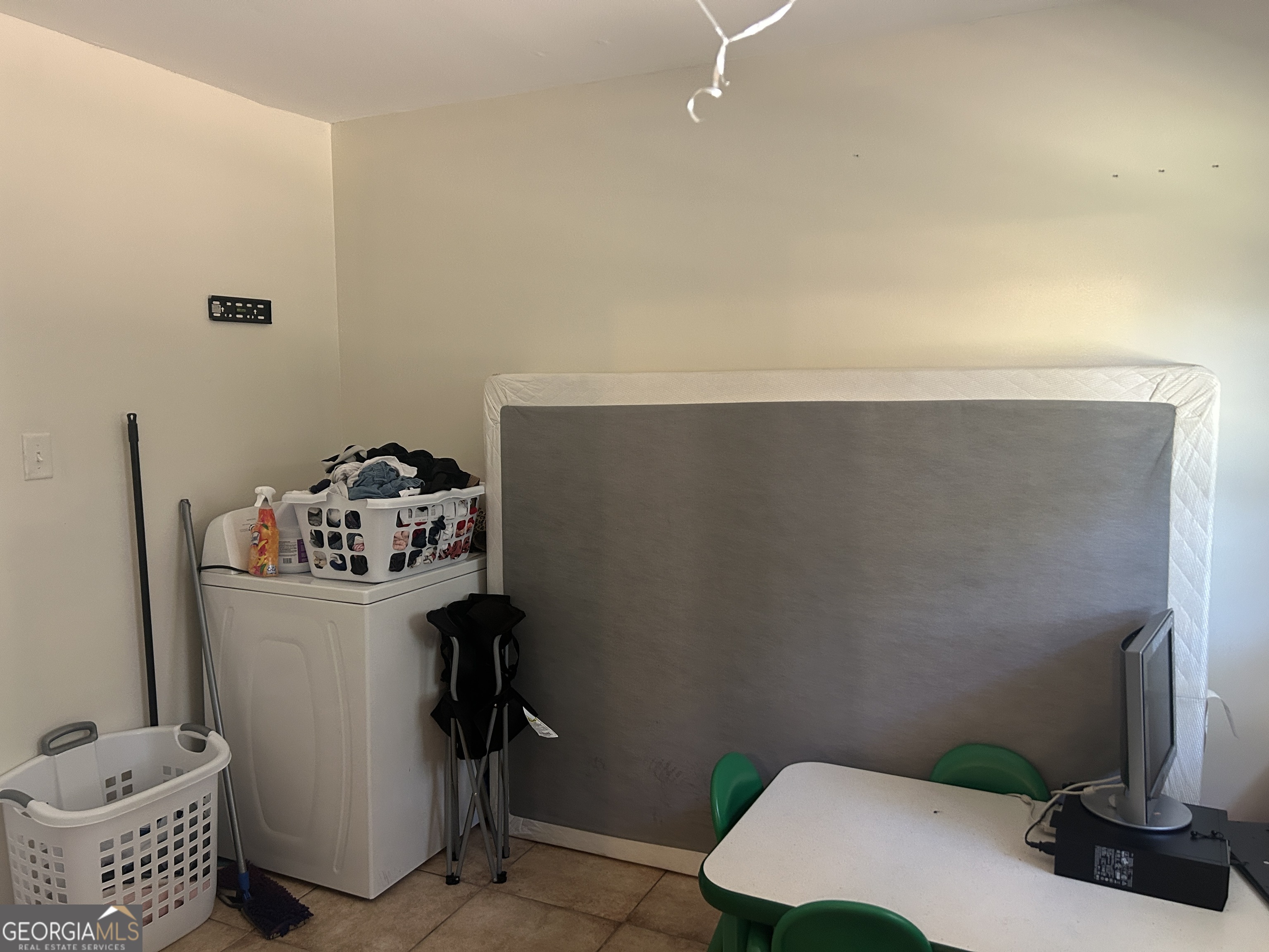 219 Oregon Trail Warner Robins, GA 31093 - Photo 8 of 8 a room with a door and a table