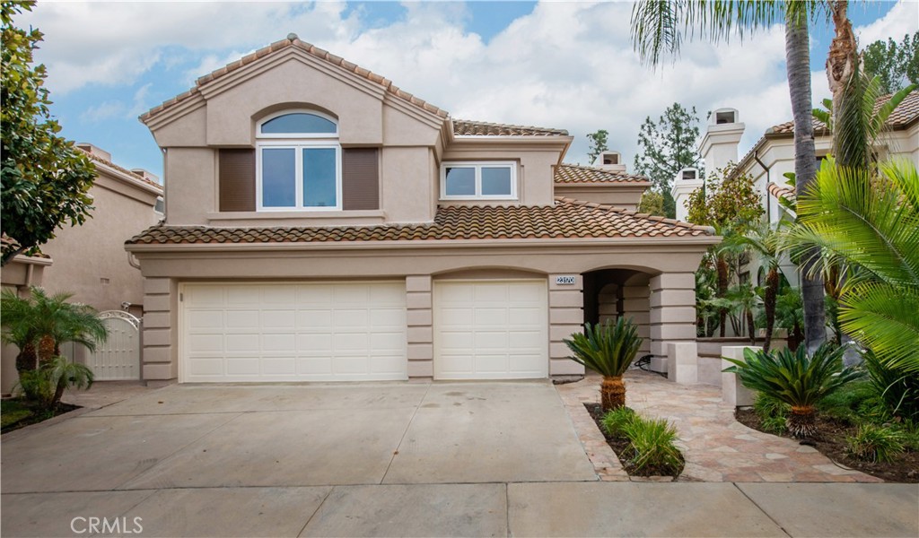 23170 Park Blanco Calabasas, CA 91302 - Photo 1 of 1 a front view of a house with a yard and garage