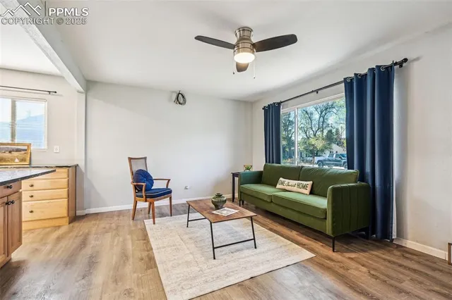 a living room with furniture and a large window