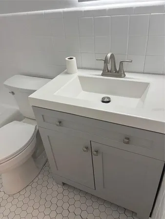 a bathroom with a sink and a toilet