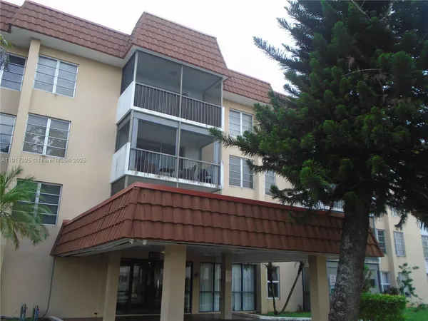 a view of house with a window and balcony