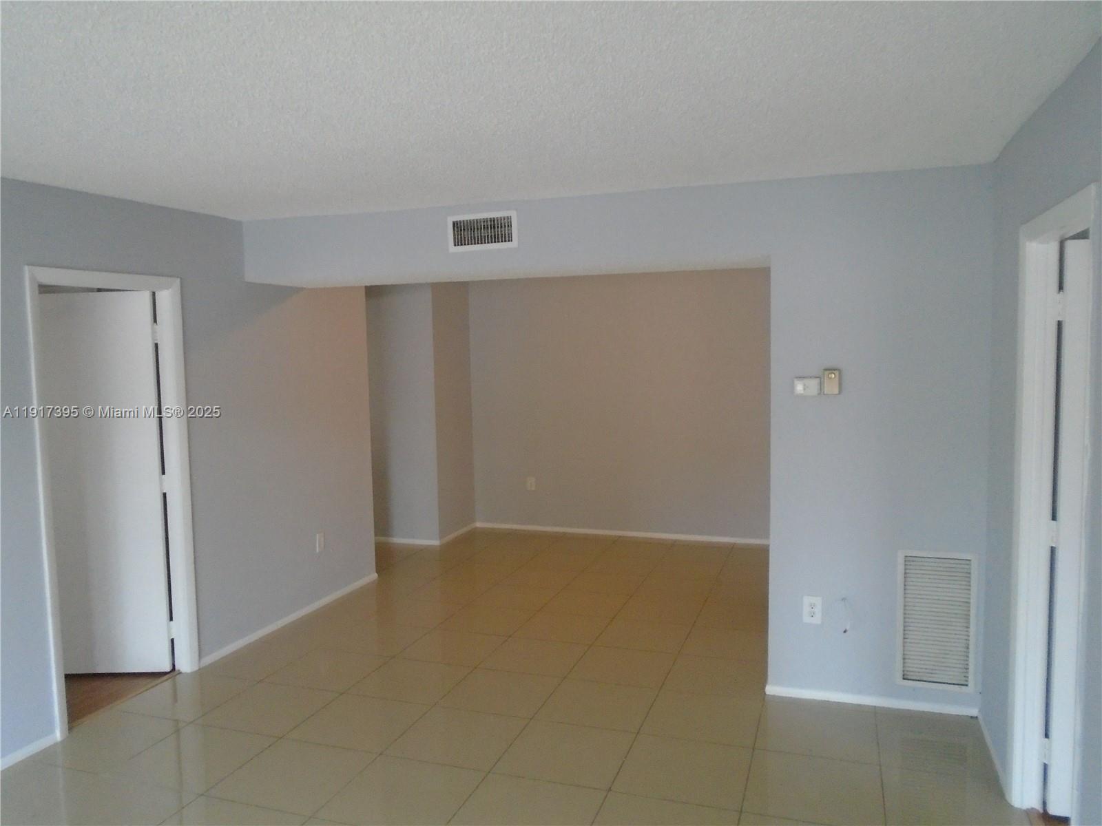 4176 Inverrary Drive, Unit 209 Lauderhill, FL 33319 - Photo 5 of 15 an empty room with closet