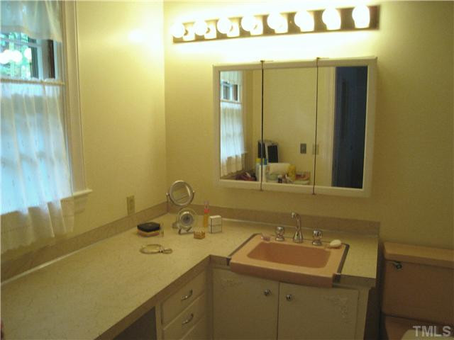 2756 McDowell Road Durham, NC 27705 - Photo 8 of 25 Master Bathroom has tub with shower & tile floor. Good sized room with a window & vanity. Pocket door. Bathroom